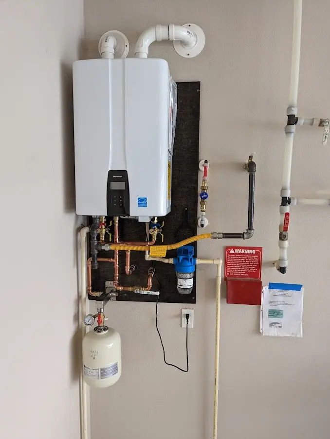 Professional plumber installing copper piping in a Winter Haven home